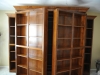 swinging-bookcases-reveal-murphy-bed