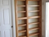 Cherry bookcase built in to niche