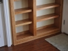 Cherry bookcase in niche