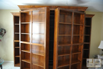 swinging-bookcases-reveal-murphy-bed